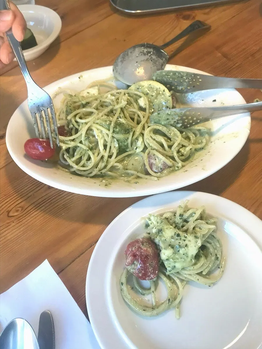 Pasta with basil pesto and tomato marinade