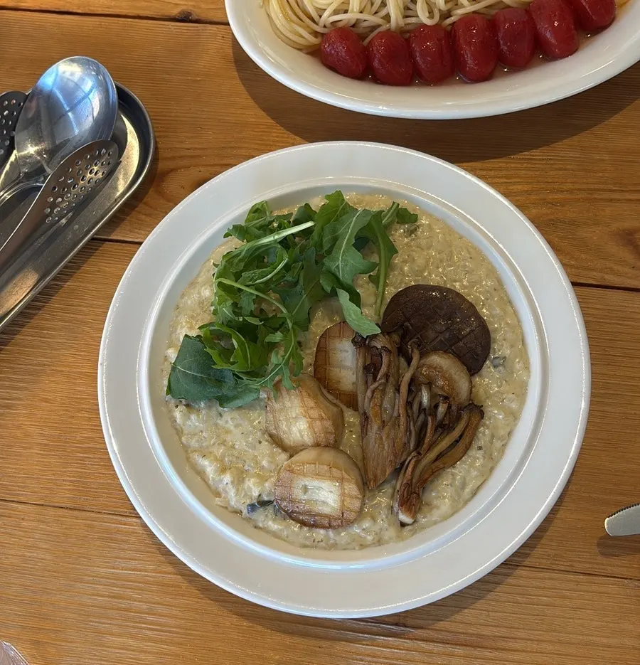 Mushroom cream risotto topped with arugula