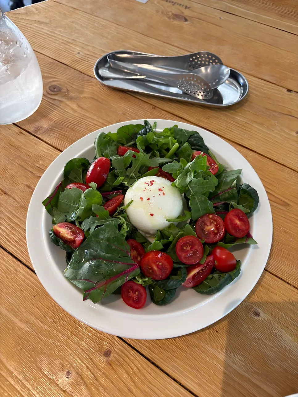 A plate of Andover's burrata tomato salad