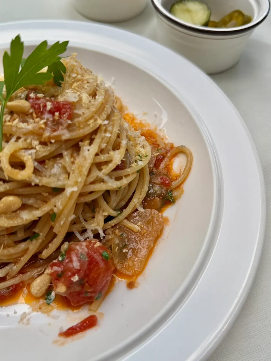Anchovy oil pasta with cherry tomatoes and black olives