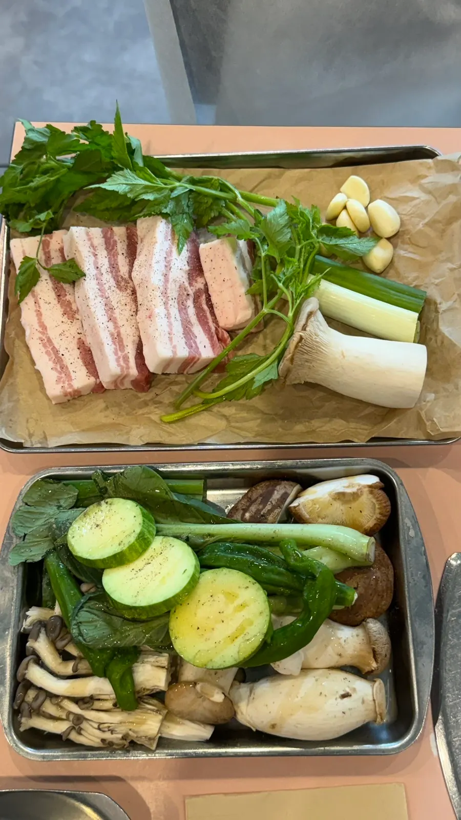 Raw pork belly served with side vegetables