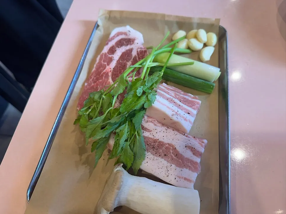 Thick-cut raw pork belly and pork neck that were ordered