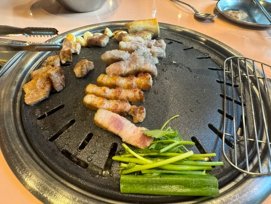 Grilled meat and vegetables plated and ready to eat