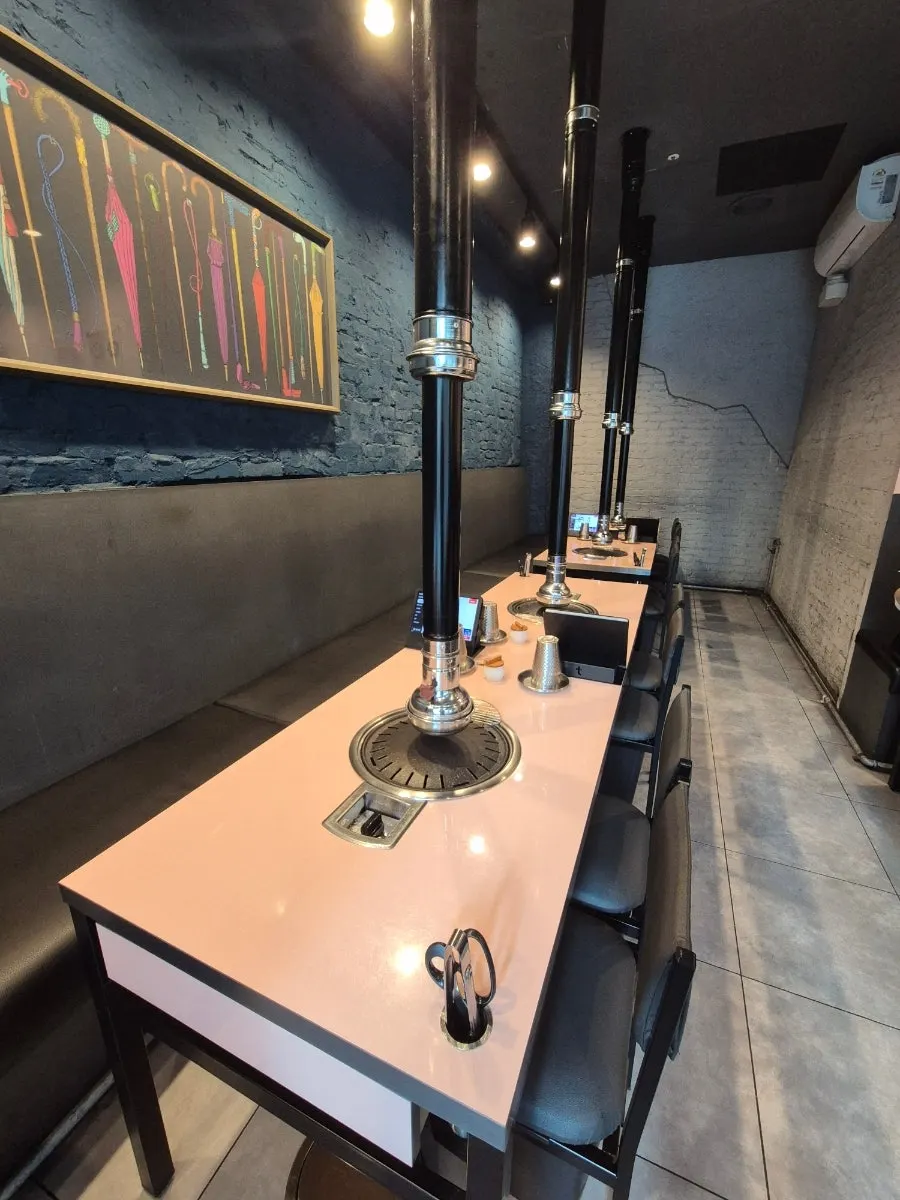 Dwaeji Mansion dining hall arranged mostly with 4-person tables
