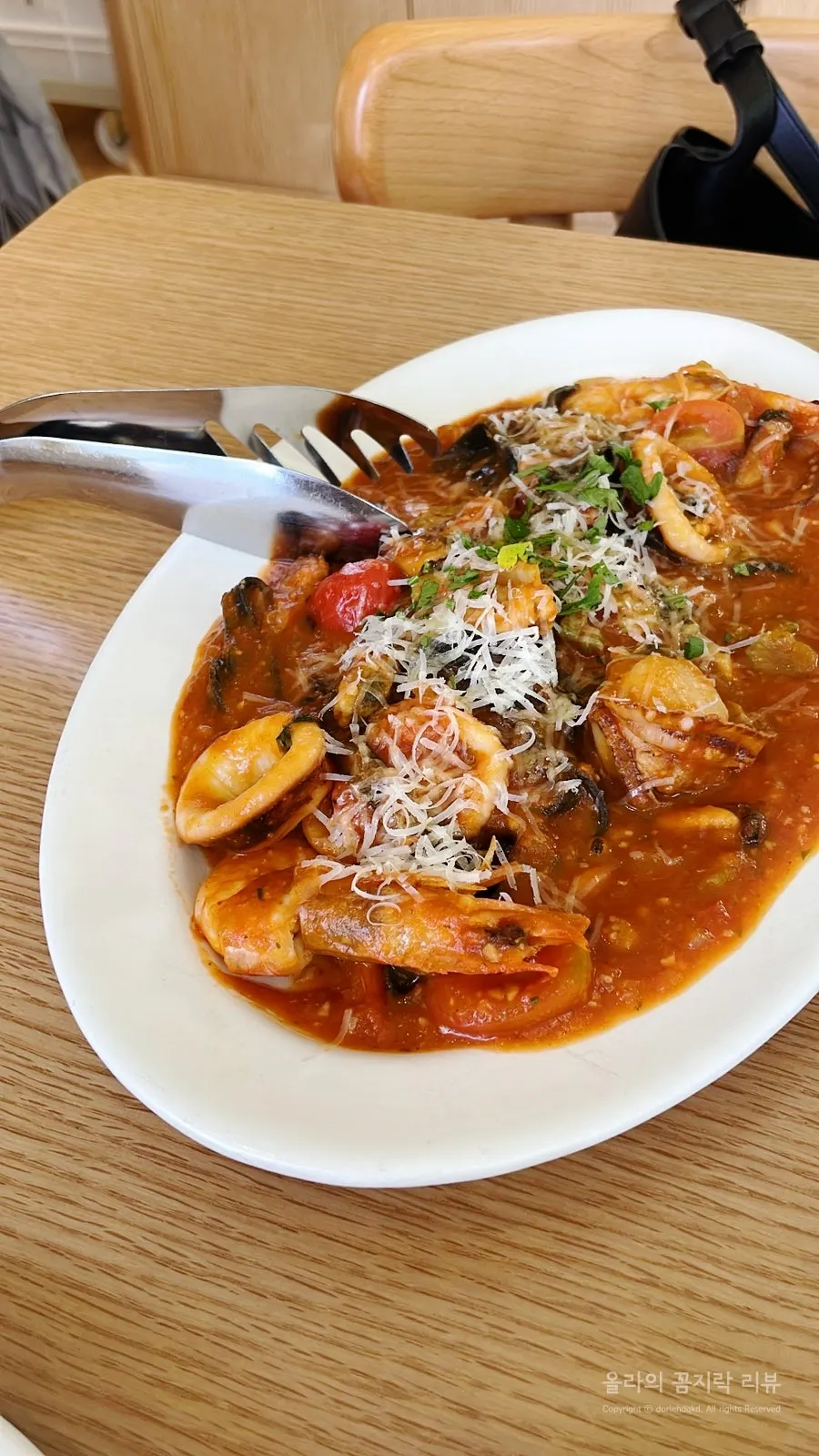 Seafood tomato fettuccine plate on the table