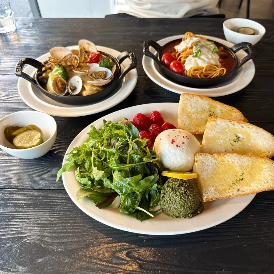 Brunch spread with salad, flounder, and pasta