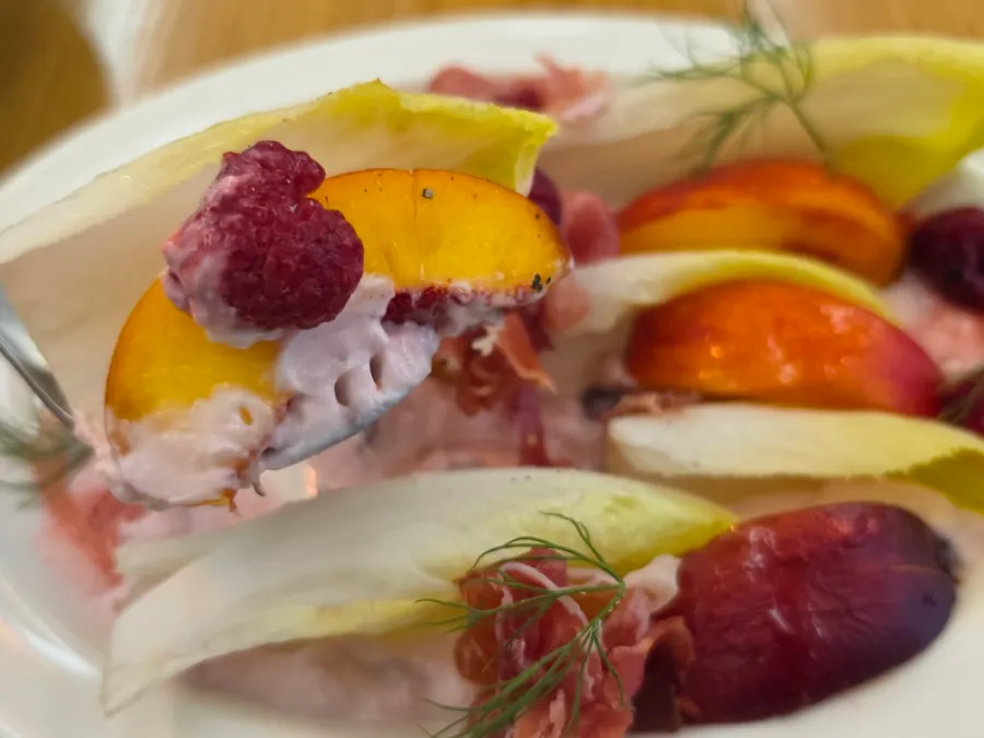 A plate of raspberry Greek yogurt and endive