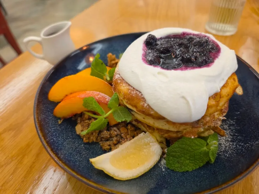 A plate of blueberry ricotta pancakes