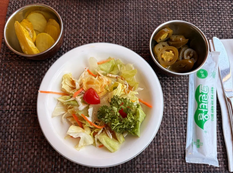 Salad served with jalapeño pickles