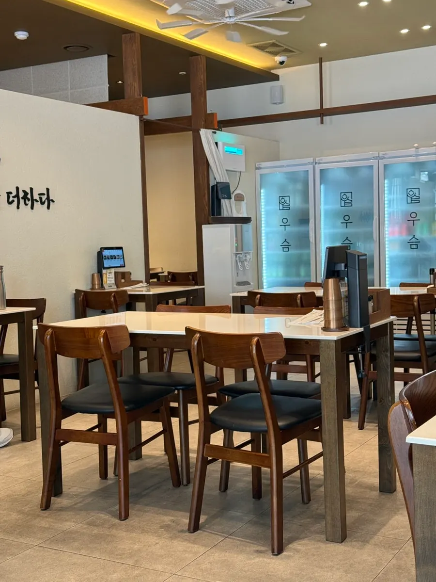 Vertical photo of the well-lit main hall at Useum Pangyo Branch