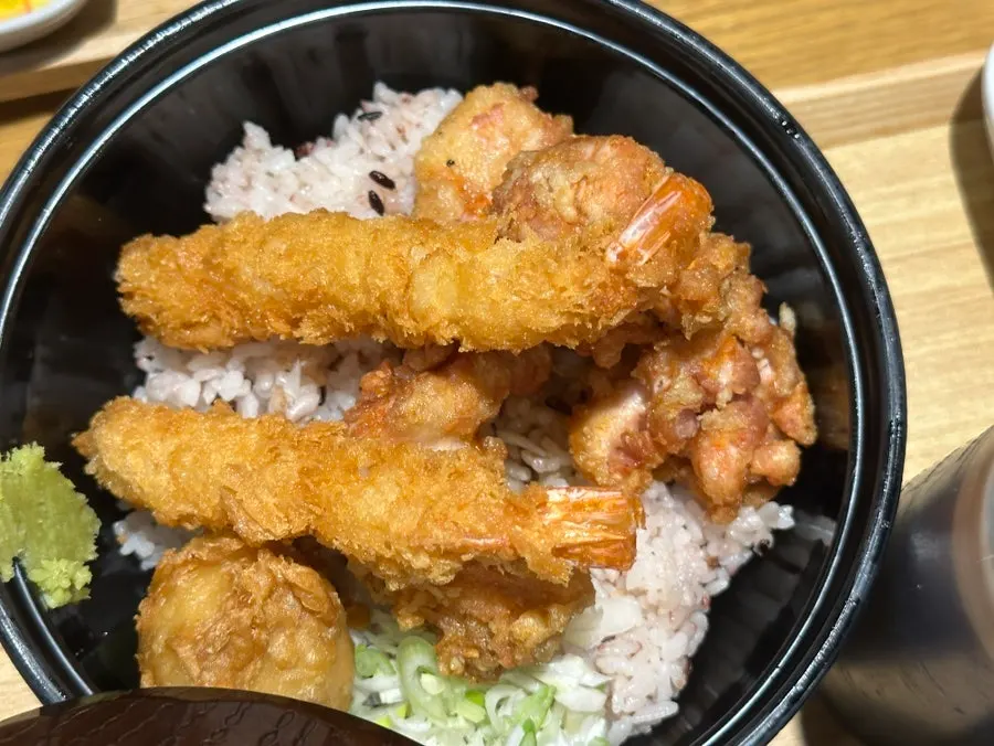 Eating kimchi cheese katsu nabe with rice