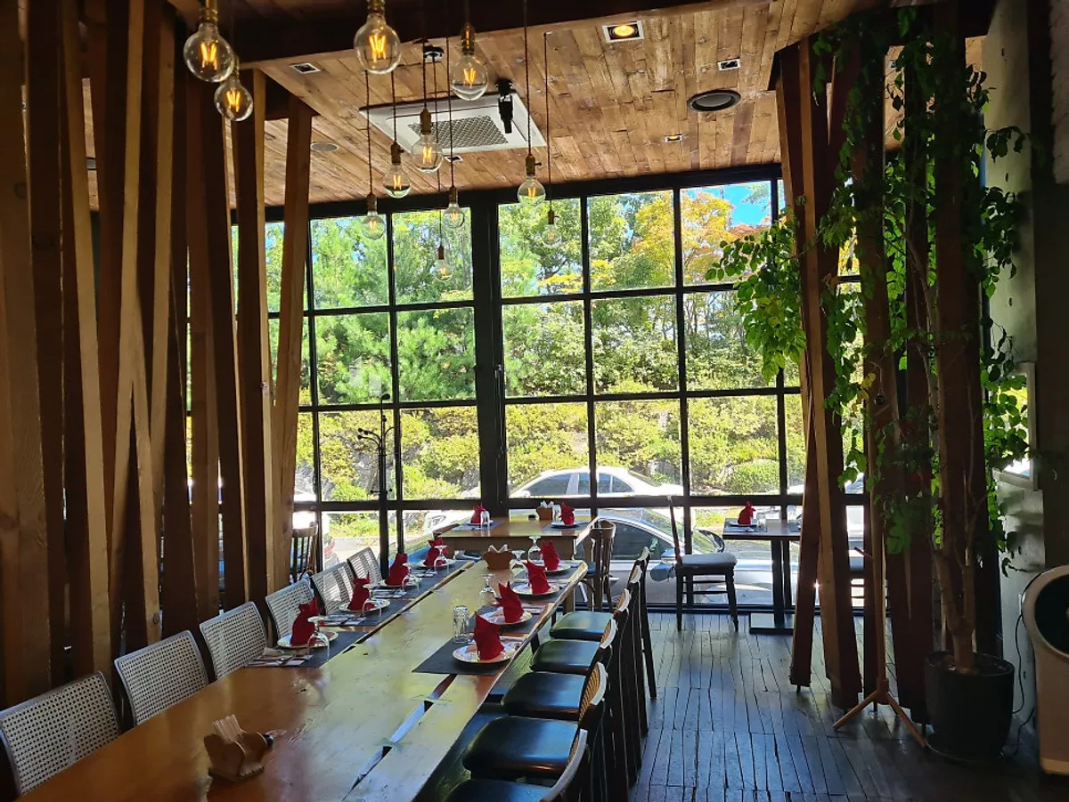 Spacious dining hall decorated in wood tones with tile accents