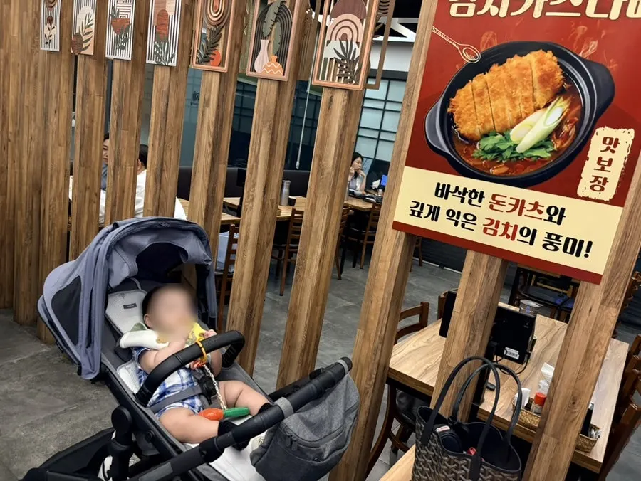 9-month-old baby waiting patiently at the table
