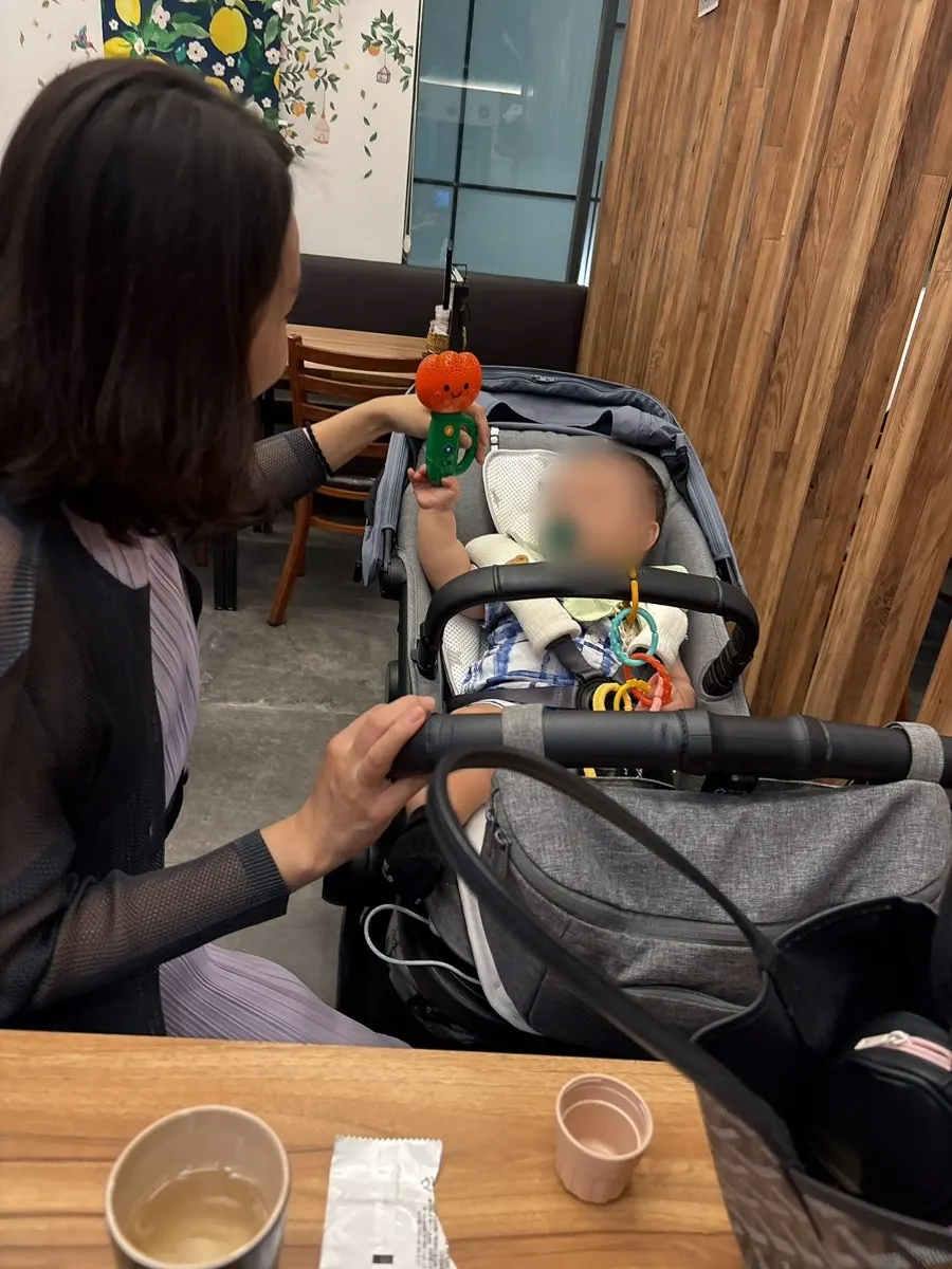 Vertical shot of the table with baby in tow