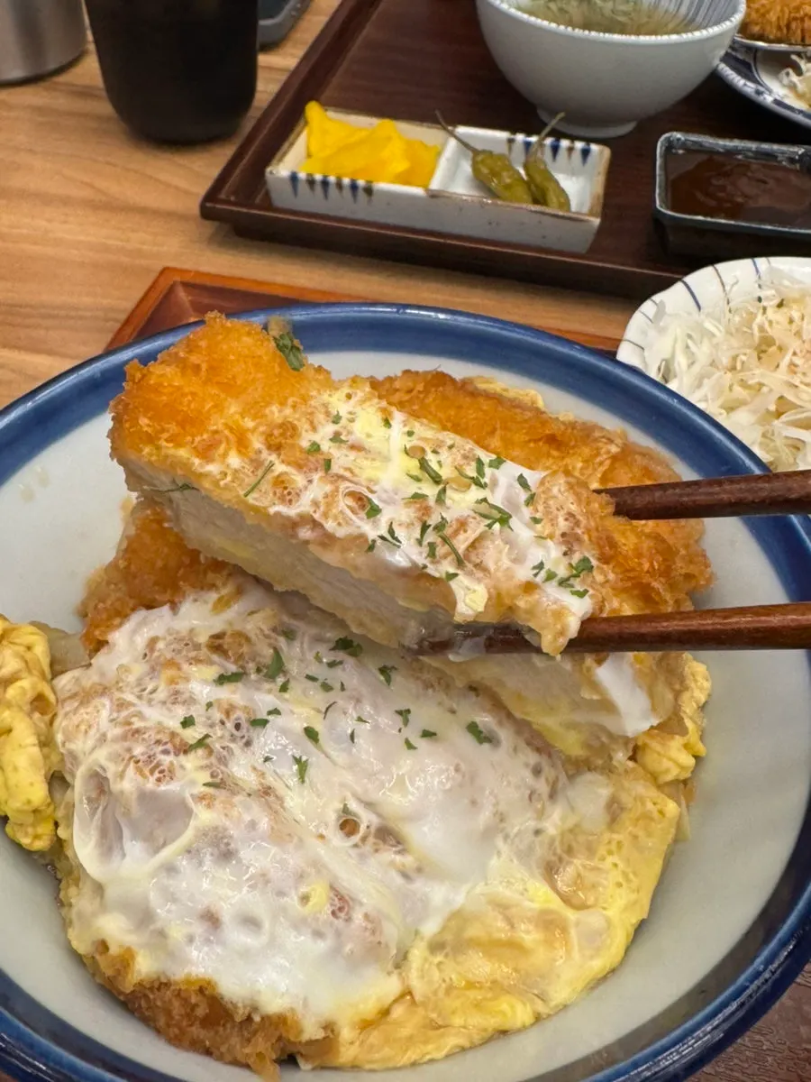 Crispy loin katsu placed over seasoned rice