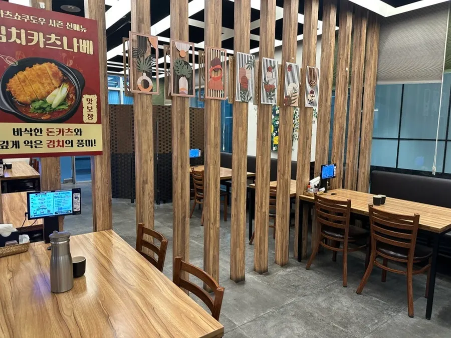 Spacious interior of Katsu Shokudo Pangyo Main Branch with wide seat spacing