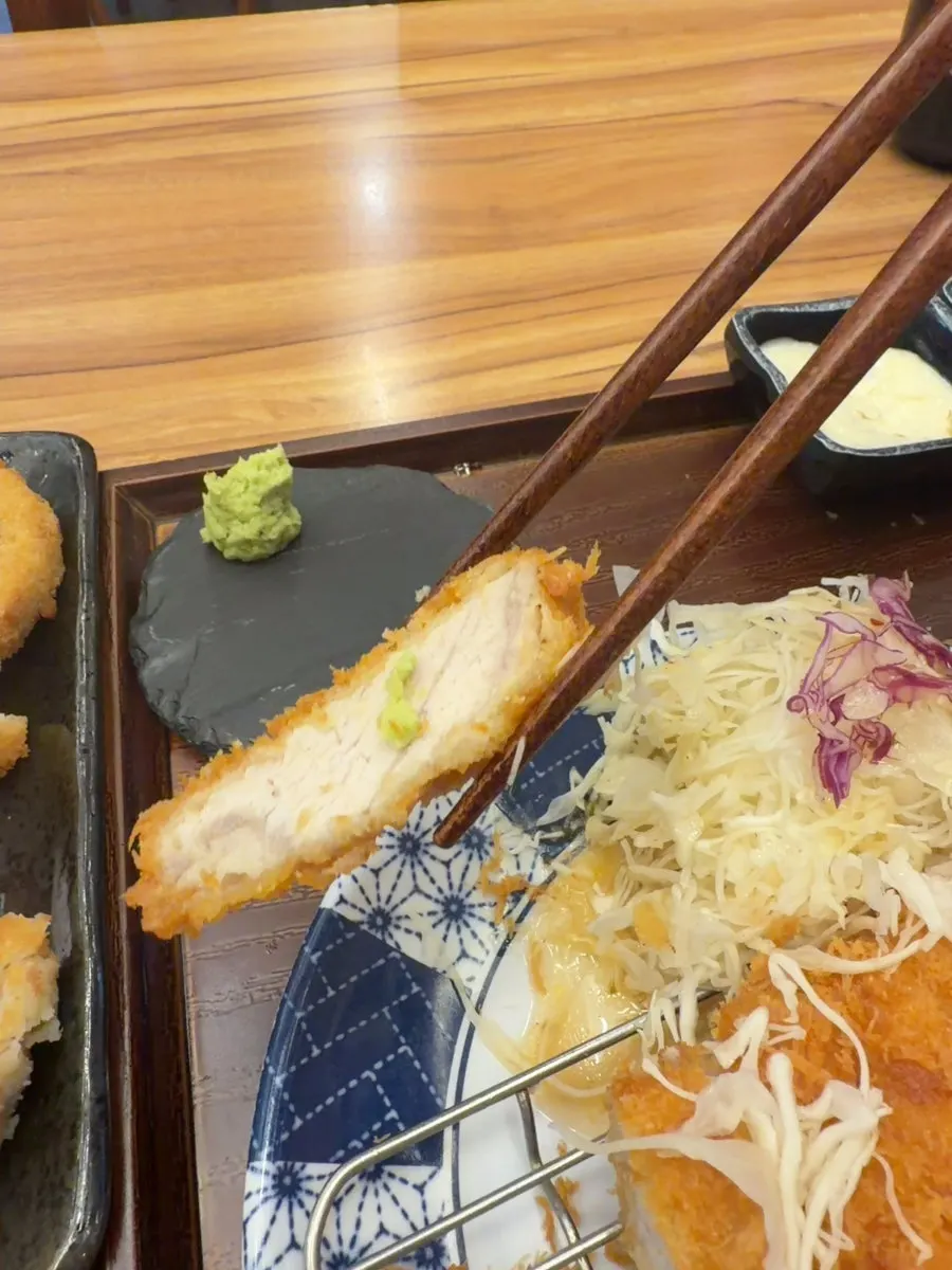 Cross-section of katsu, crispy outside and tender inside