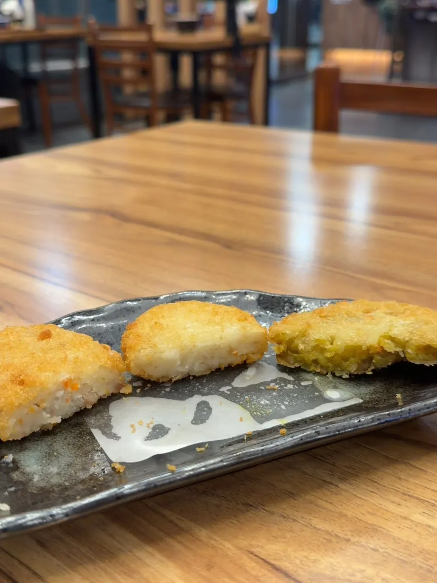 Holding up a single croquette