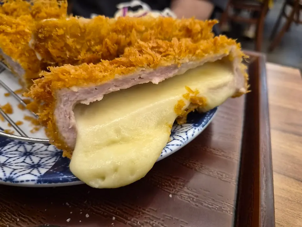 Cross-section of cheese katsu packed with cheese
