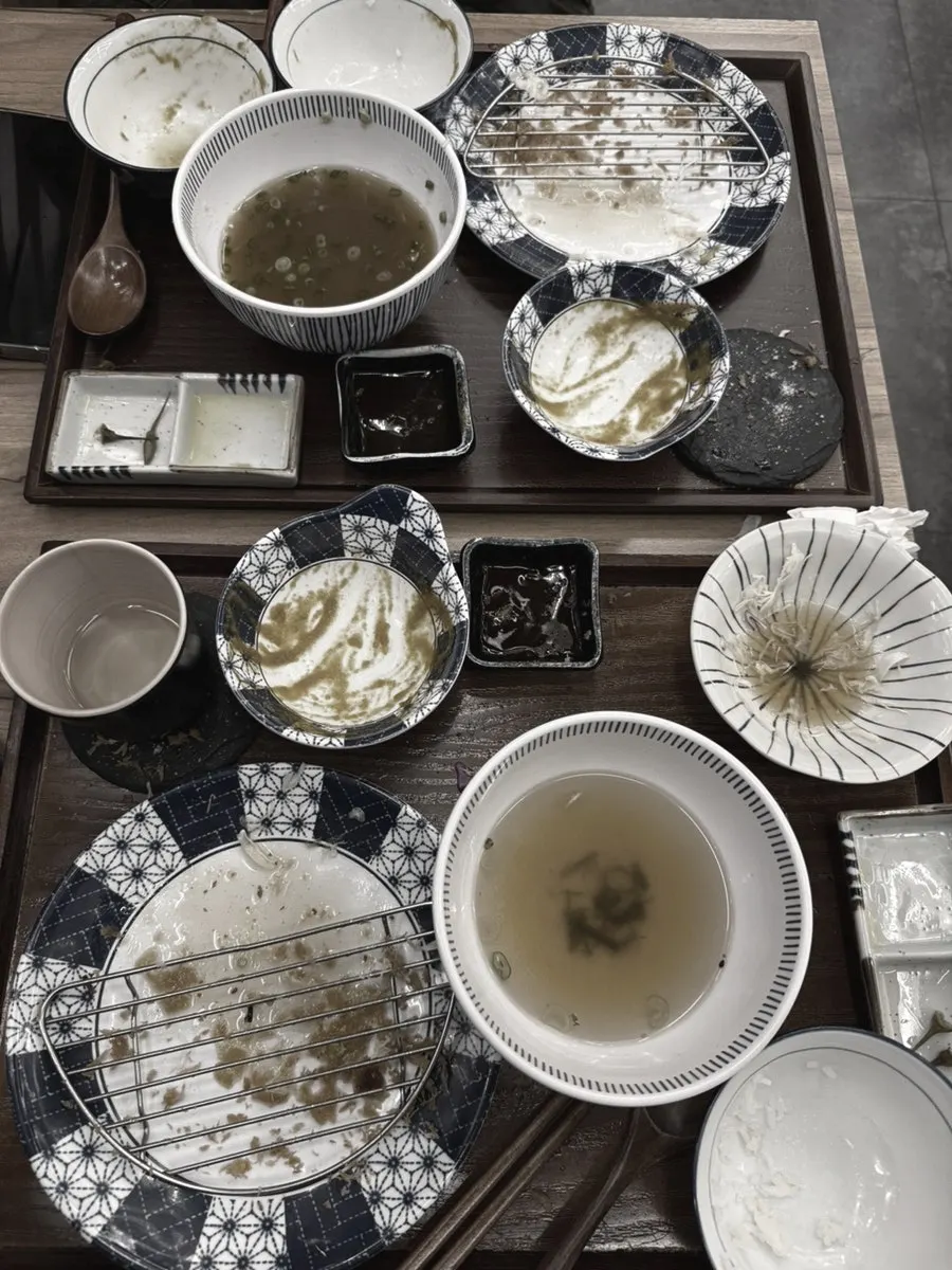 The set-for-two dishes, completely emptied