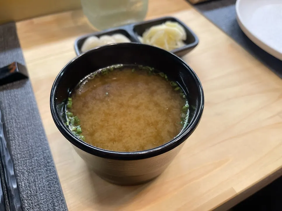 Basic table setting with pickled ginger, ginger and miso soup