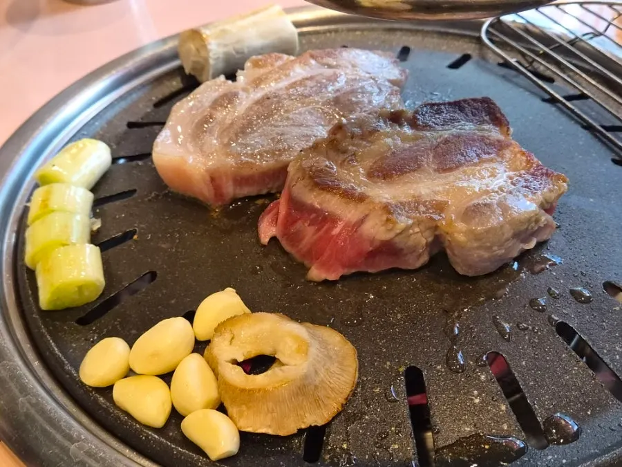 Thick pork neck grilled by staff