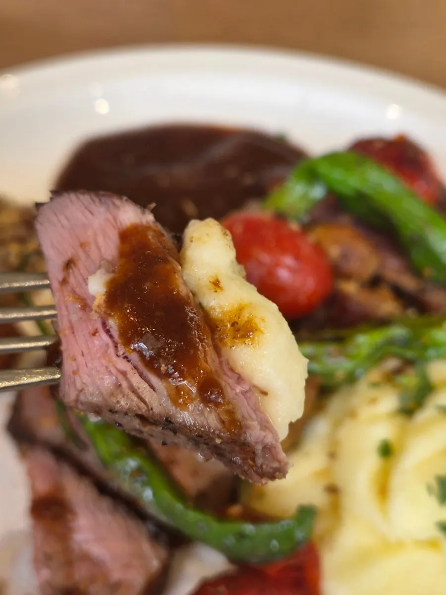 Sous-vide steak with vegetable garnishes