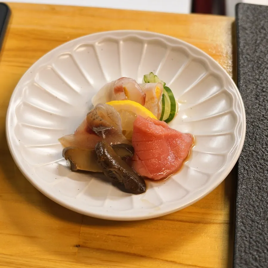 Steamed abalone with gejang sauce and a small portion of rice