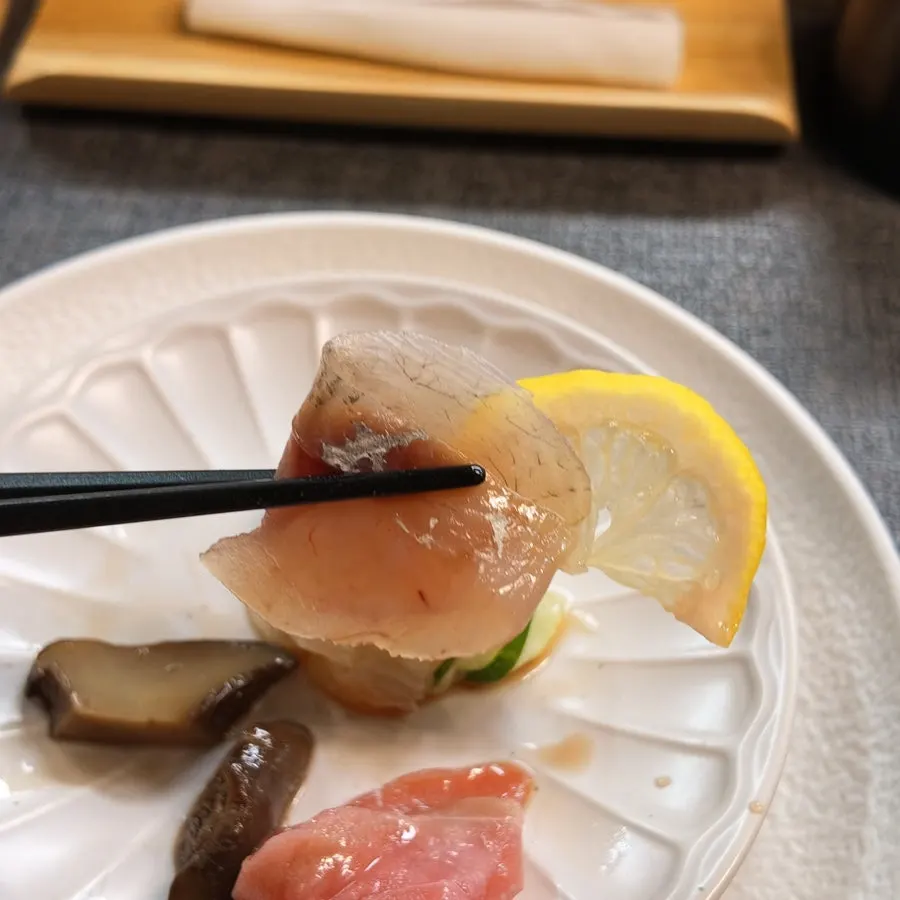 A plate of thickly sliced sashimi with several kinds