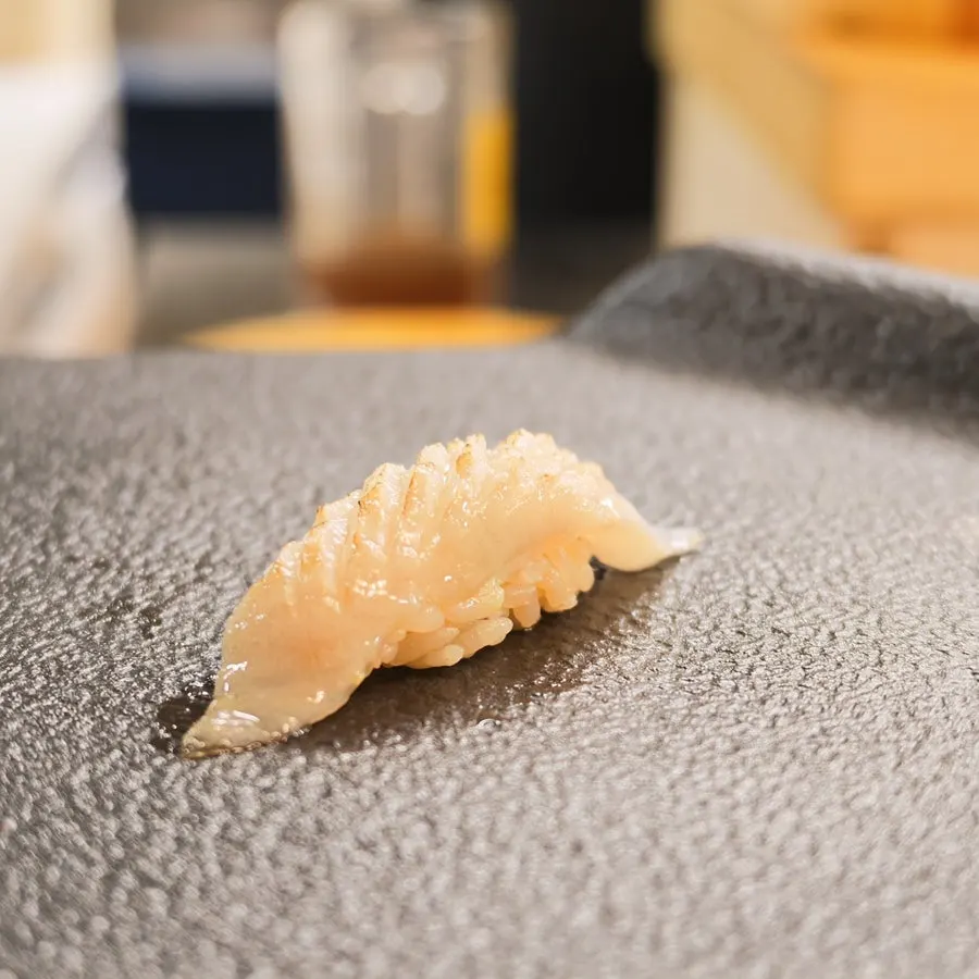 Herring sushi topped with pickled ginger