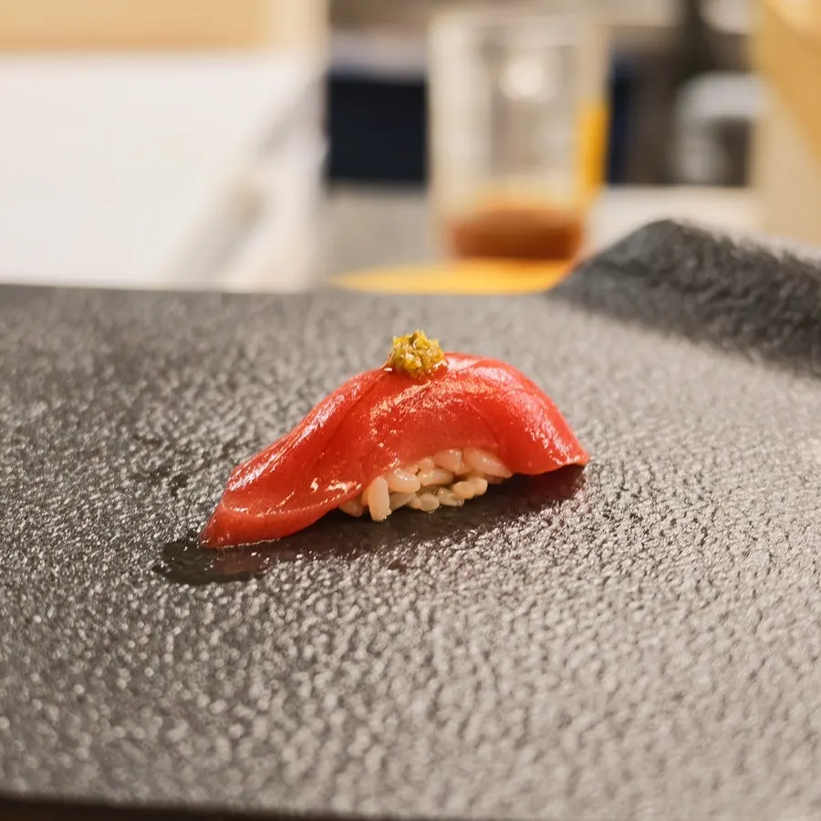 Squid sushi with tightly scored cuts