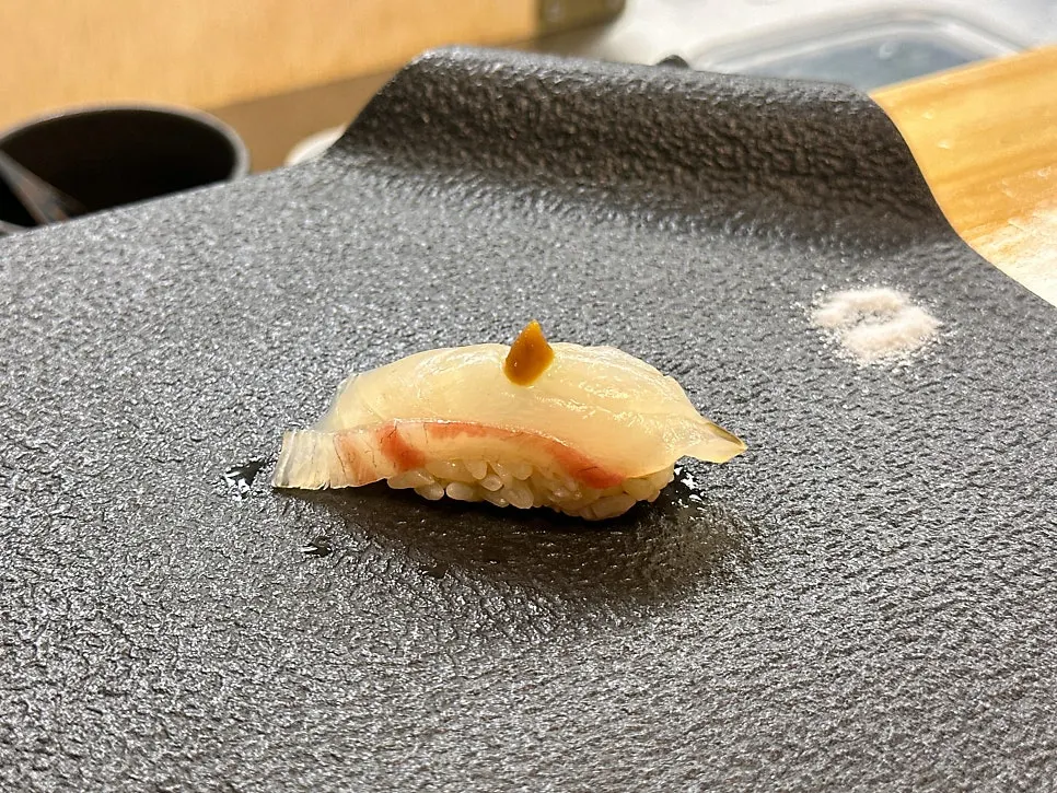 Omakase sushi served with an explanation of the ingredients