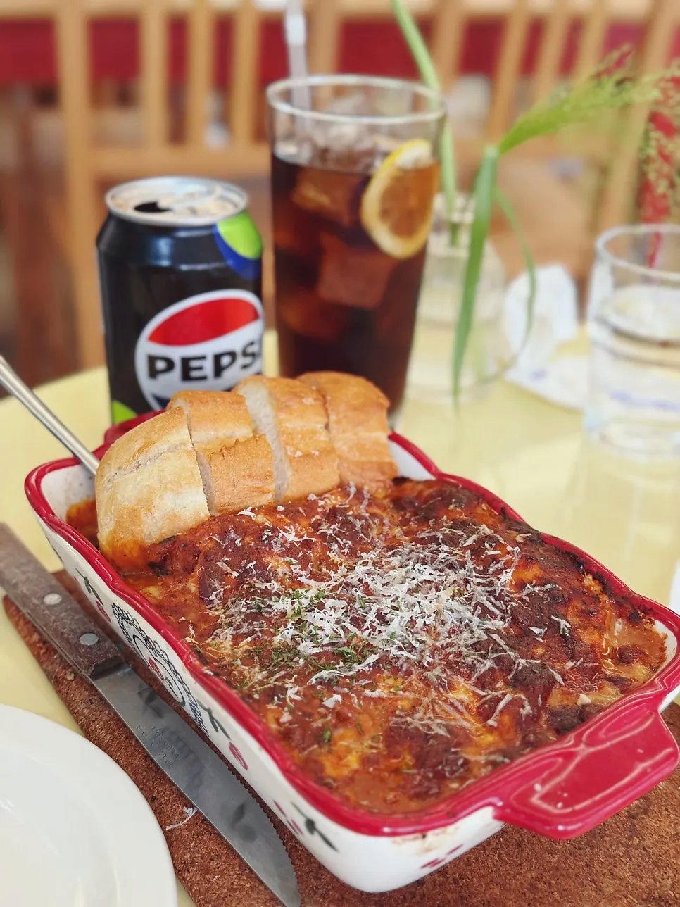 Lasagna served with baguette