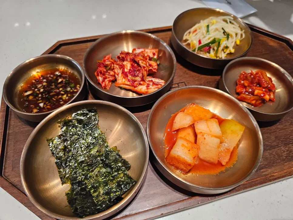 Side dishes on a wooden tray