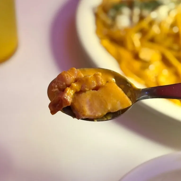 Pasta with visible thick bacon pieces
