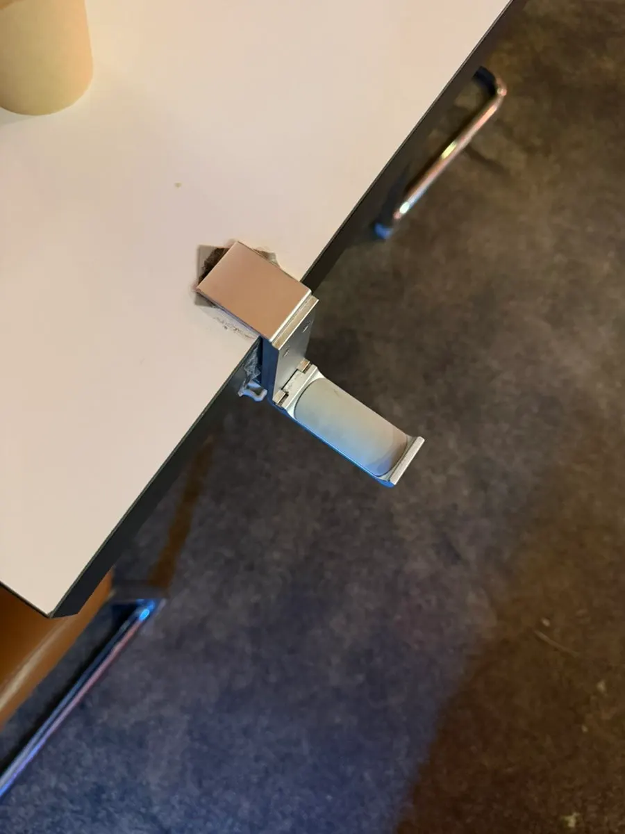 Orange table lamp and bag hanger accent at the table