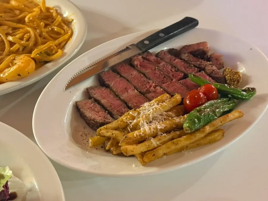 Sous vide skirt steak served with truffle Cajun fries