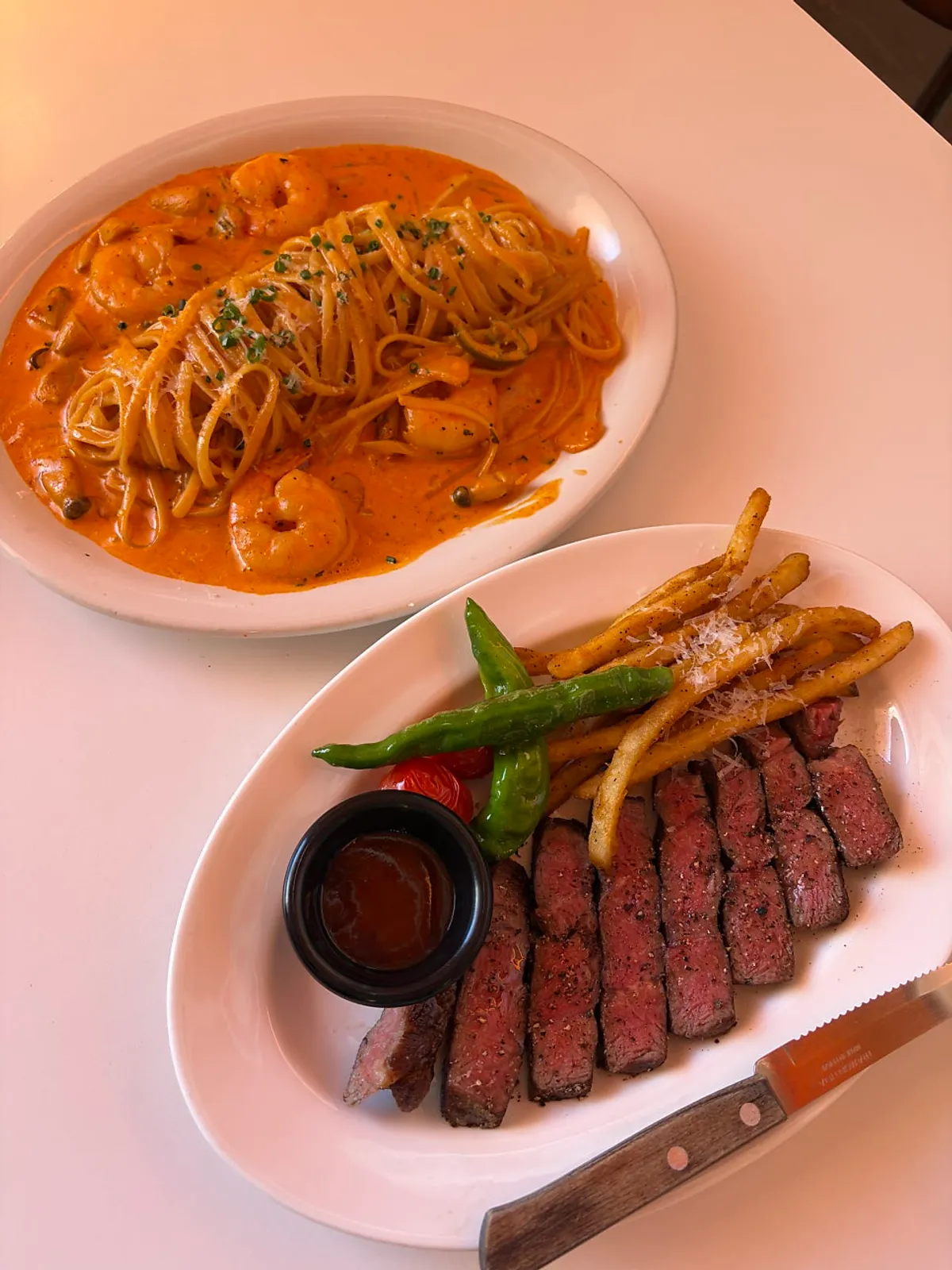 A full spread of steak and pasta at Panna Seomyeon Main Branch