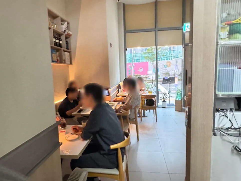 High-ceilinged interior and table spacing at Paol