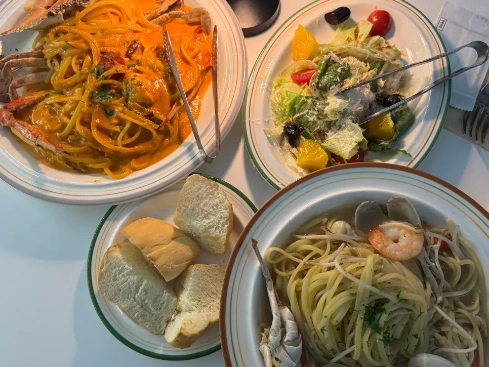 Table for two with pasta set plus extra bread