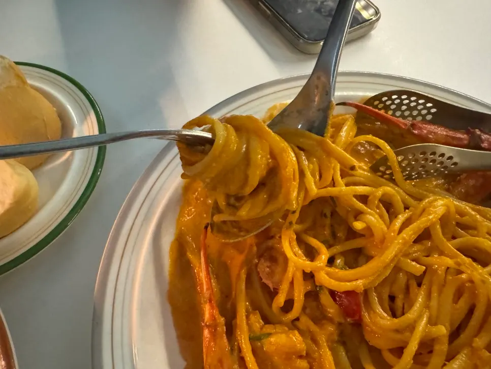 Spicy crab rose pasta topped with crab
