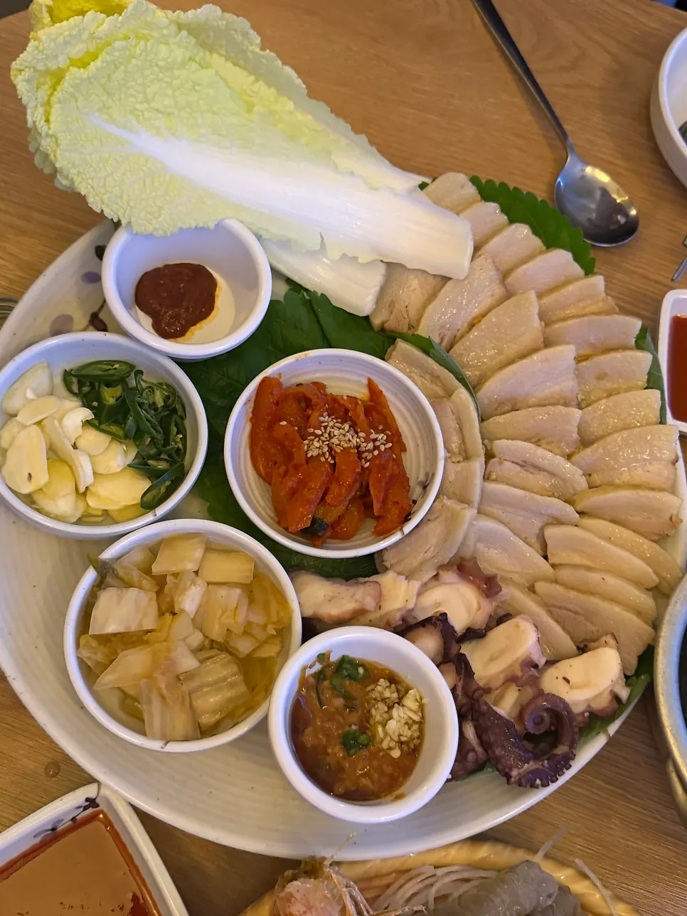 Plating of stone octopus and haenyeo bossam