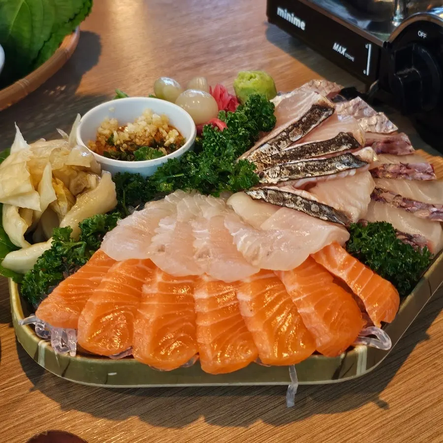 Small aged sashimi platter on a bamboo tray