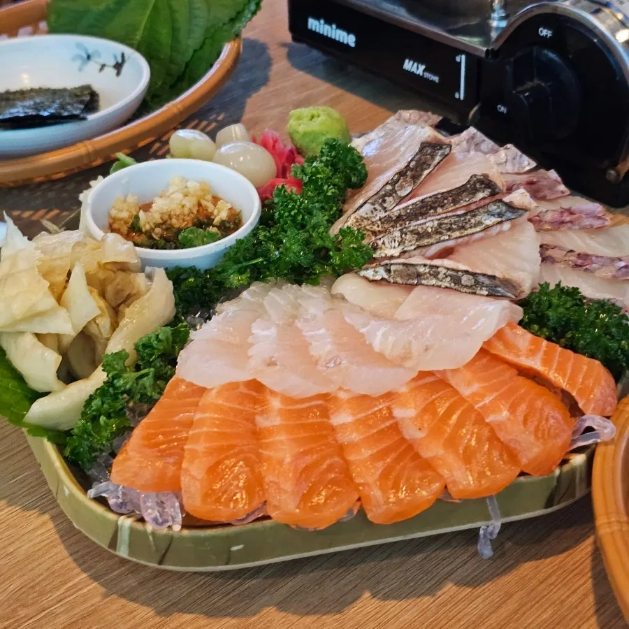Aged kimchi and house ssamjang served alongside the sashimi