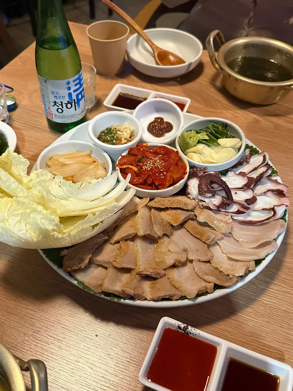 Raw octopus and Jeju bossam, a high-protein dish at Parang Haenyeojip on Sinsa Garosugil