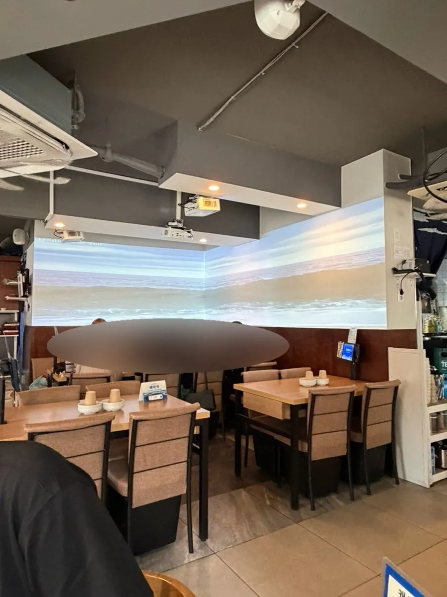 Wall screen playing a wave video