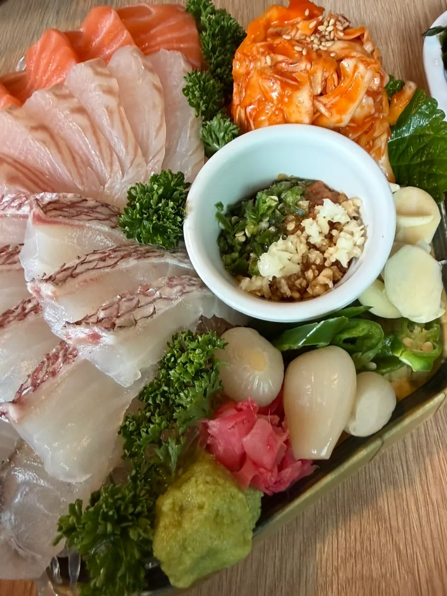 Tray of makjang, cabbage salad, and other side pairings