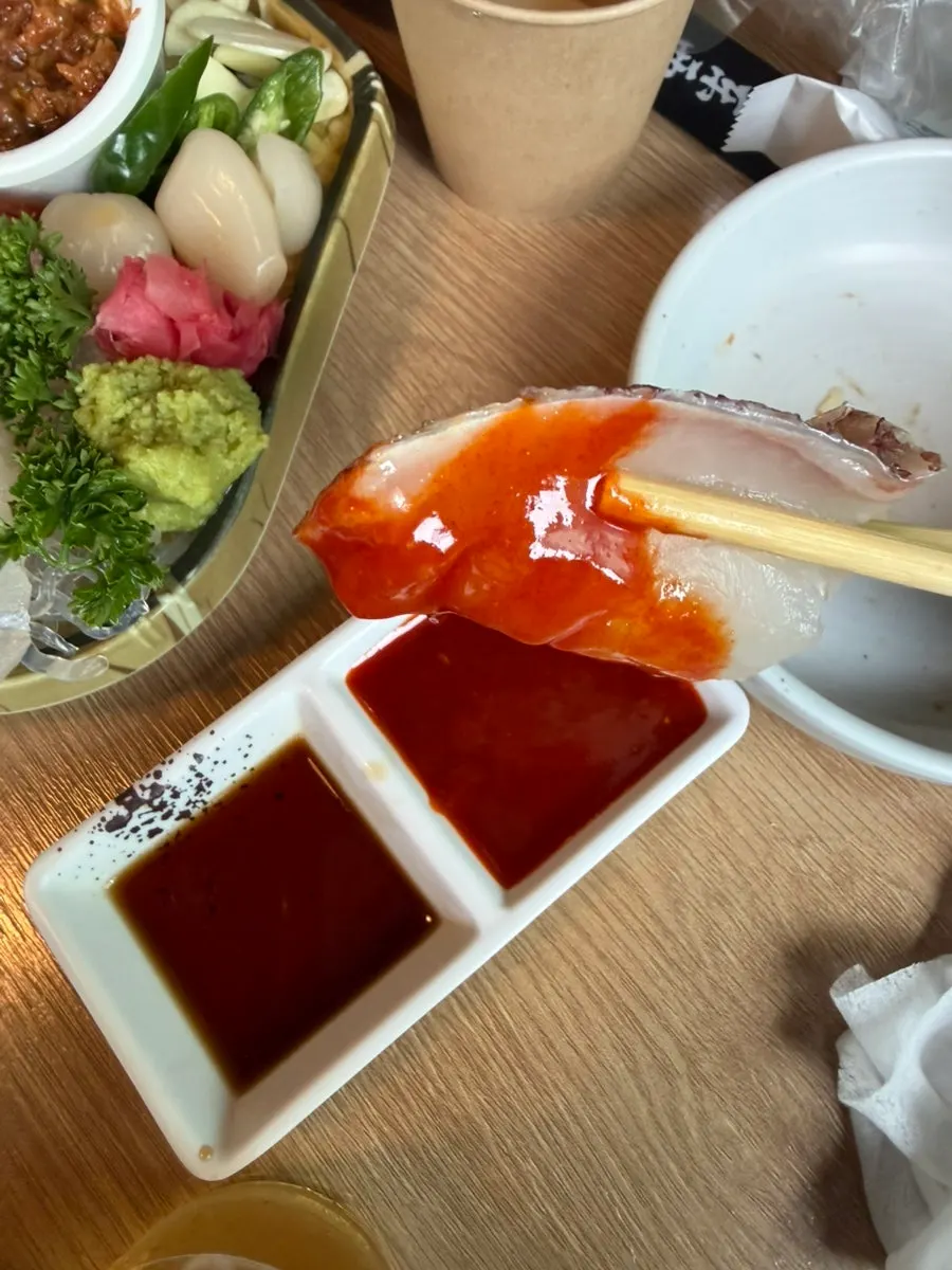 A piece of aged sashimi placed on sushi rice