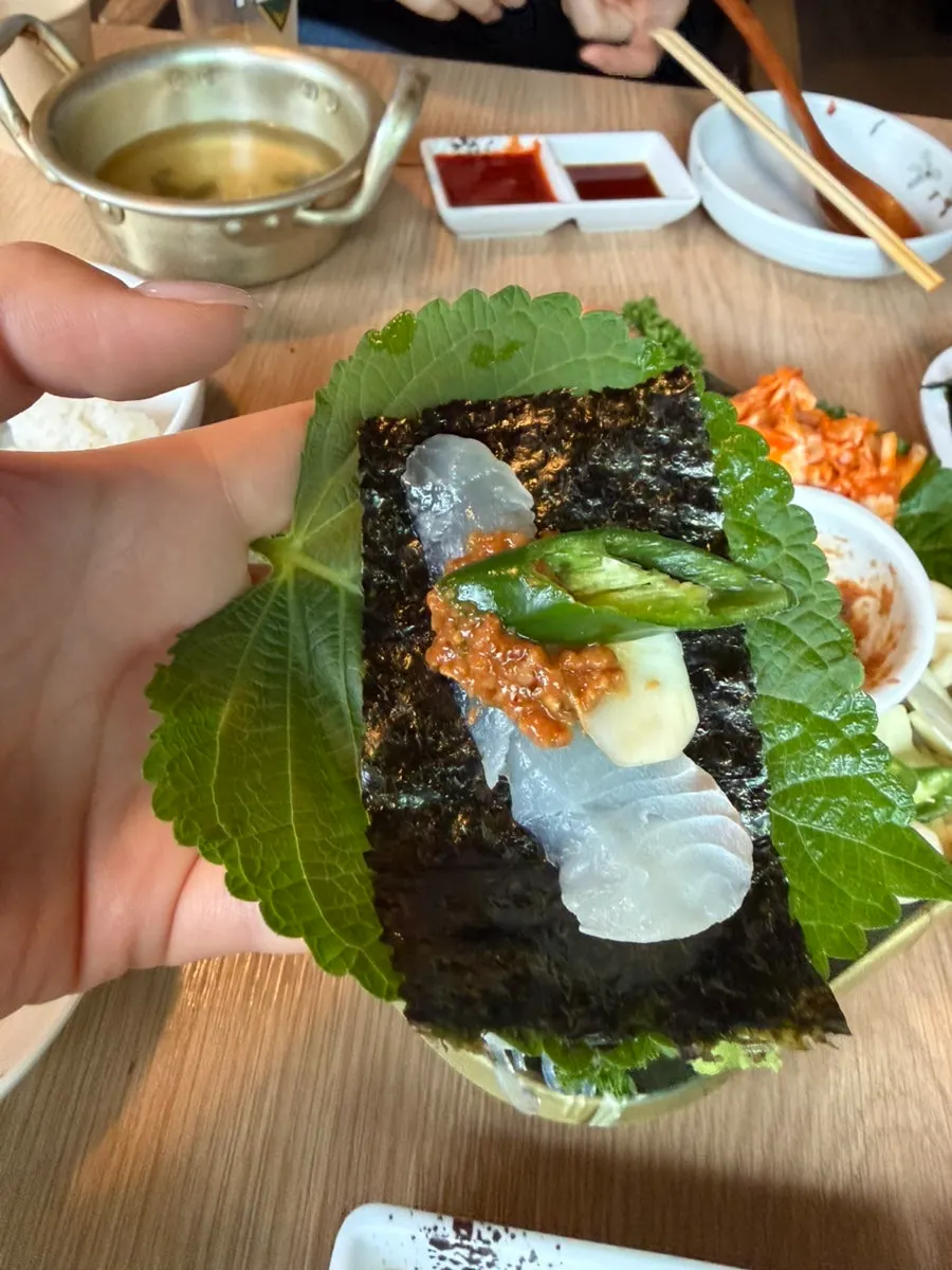Aged sashimi wrapped in perilla leaf