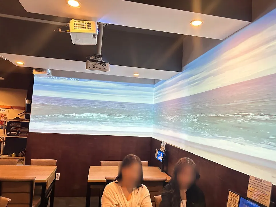 Large in-store screen playing ocean footage